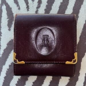 Cartier small coin purse in good used condition. Still elegant looking